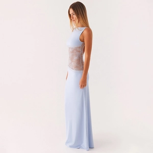 Detail view of lace patchwork on a slim-fit light blue sleeveless maxi evening dress