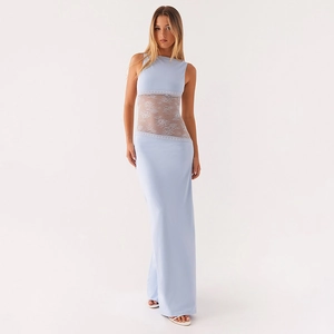 Detail of floral white lace patchwork on a light blue satin slim fit backless maxi dress