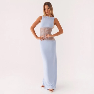 Detail of light blue maxi dress featuring delicate lace patchwork and slim fit design