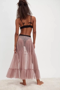 Detail view of pink layered mesh skirt featuring delicate heart prints and tiered tulle fabric