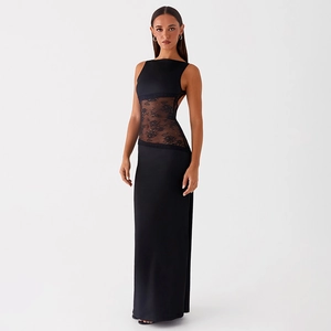 Close-up of intricate black lace patchwork on a sleek backless satin maxi dress