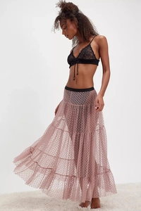 Detail of multi-layered mesh skirt featuring heart print and elastic black waistband