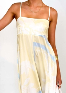 Close-up of floral print satin summer dress featuring thin straps and square neckline