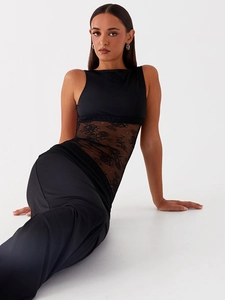Detailed view of the sheer black lace panel and satin texture on a slim-fit maxi dress