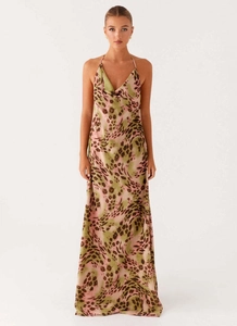 Detail view of the elegant cowl neck and leopard print pattern on a silk satin dress