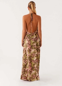 Detail of the backless halter design and colorful leopard print on long maxi dress