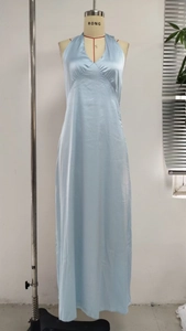 Close-up of the light blue satin dress featuring a deep V-neck and slim waist design