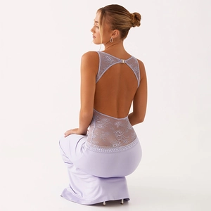 Detail view of the open-back design with lace floral texture and satin finish on lavender dress