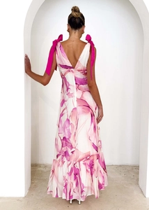 Detail of the V-neck open back design on a long floral printed summer dress