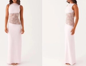 Close-up of pink long dress with floral lace cut-out at waist and high halter neck detail