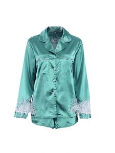 Elegant emerald green satin pajama set with luxury white feather trim on long sleeves