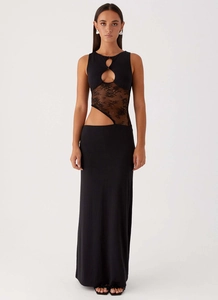 Detail of the chic cutout waist with floral lace splicing on the black bodycon maxi dress