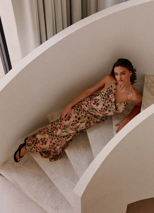 Detail shot of leopard print dress material on white marble spiral staircase