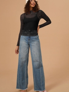 Sheer mesh long sleeve top with bow patterns styled with wide-leg jeans and knit hat