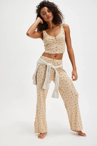 Floral V-neck pajama set detail featuring beige print fabric and button side slit pants