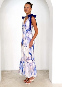Detail of V-neck sleeveless floral maxi dress with contrasting blue bow shoulder straps