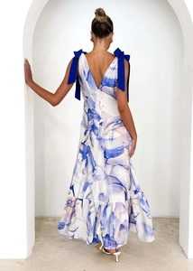 Detail view of V-back summer dress with blue floral print and shoulder ribbon bows