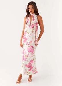 Detail of sexy halter neck floral maxi dress with pink watercolor print and V-neckline