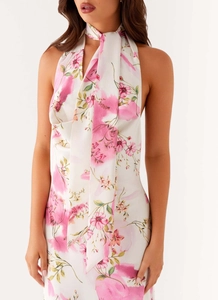 Close-up of halter neck dress with pink floral digital print and satin finish