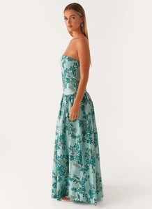 Detail of bohemian strapless maxi dress with teal floral print and pleated skirt