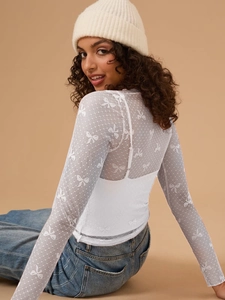 Slim fit white mesh long sleeve T-shirt with bow patterns and sheer texture