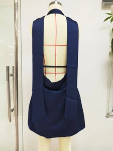 Detail of deep blue satin backless mini dress with elegant hanging neck streamers