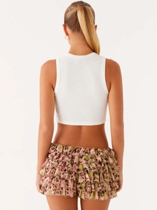 Women's white ribbed crop top paired with pink leopard print tiered ruffle mini skirt