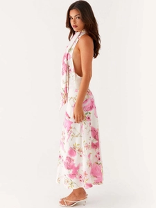 Elegant white halter neck backless maxi dress with pink floral prints for summer vacations