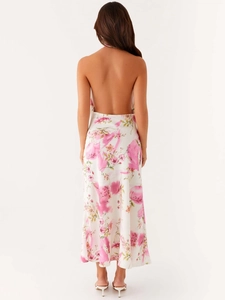 Elegant backless halter maxi dress with pink floral watercolor print on a white fabric