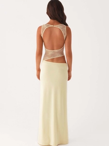 Elegant backless yellow maxi dress with intricate white floral lace cutout and open back detail