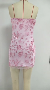 Detailed view of pink sequin floral embroidery on a mesh strapless mini dress