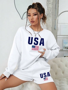 Detail of white USA crewneck sweatshirt and shorts set with navy letter print