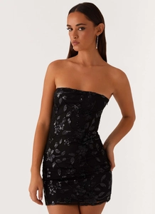 Close-up of black strapless mini dress with detailed floral sequin embroidery on mesh