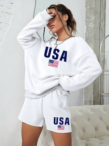 Detailed close-up of white USA logo and flag print on soft cotton lounge sweatshirt