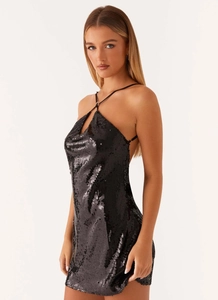 Detail shot of black sequin halter dress with shimmering finish and delicate neck straps