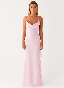 Detail of light pink satin cowl neck dress with 3D floral accent and side ruffles