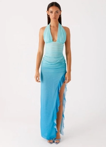 Macro detail of light blue halter neck dress with ruched mesh and ruffled side slit
