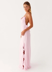 Detail of light pink floral strap dress showing the high slit and layered ruffle texture