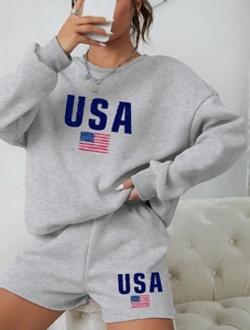 Detail of USA print and flag on gray crewneck sweatshirt and shorts set fabric