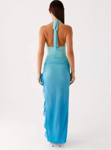 Detail of light blue halter dress showing open back design and ruffled mesh texture