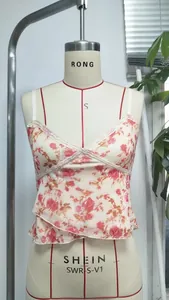 Close-up of floral mesh camisole featuring delicate lace trim and red rose pattern