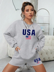 Detail of USA letter print and flag on gray crewneck sweatshirt and shorts set