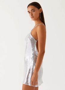 Detail view of shimmering silver sequins on the backless V-neck party mini dress