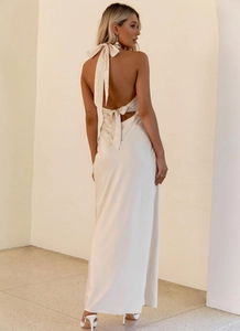 Elegant backless satin evening dress with halter neck and bow tie detail in pearl white