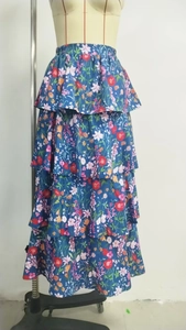 Detail view of navy blue floral maxi skirt with multi-layered chiffon ruffles and elastic waist