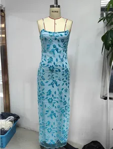Detail of light blue sequin floral embroidery and beads on a halter bodycon dress