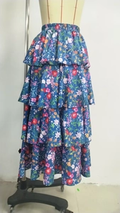 Detail of layered floral tiered skirt with navy blue pattern and elastic waistband