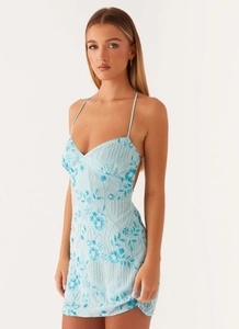Detailed view of light blue dress with 3D floral embroidery and beaded sequins