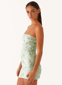 Detail of floral embroidery and sequins on mint green strapless bodycon mini dress