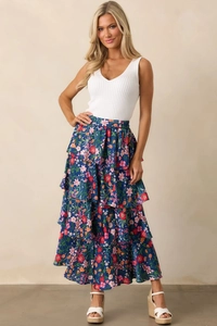 Detail of navy blue floral tiered maxi skirt with high elastic waist and layered design